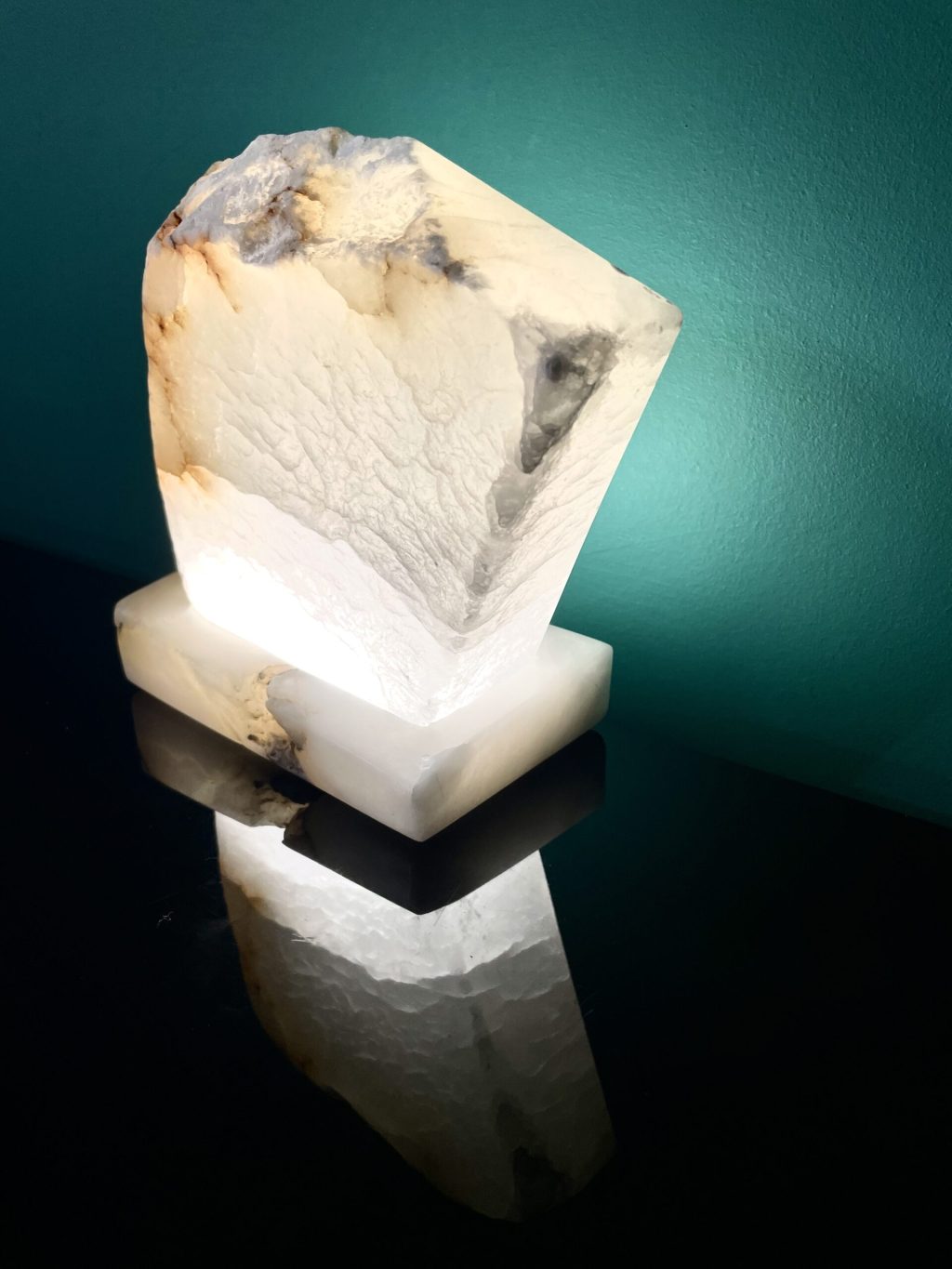 Illuminated translucent Alabaster. Lit from the back it shows the internal fractures of the stone, creating a window through the stone