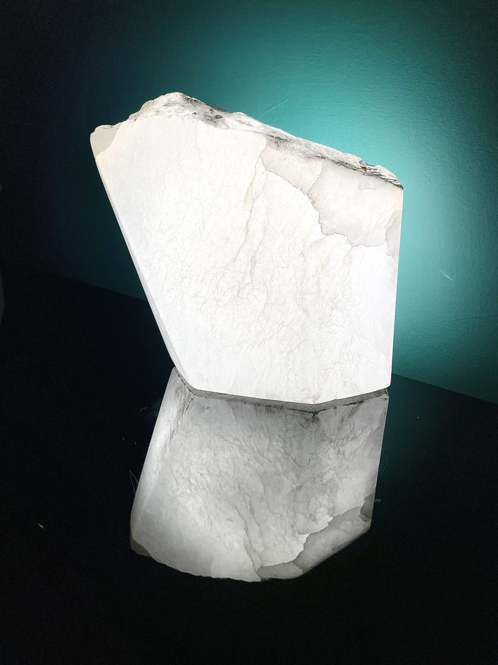 Illuminated translucent Alabaster. Lit from the back it shows the internal fractures of the stone, creating a window through the stone