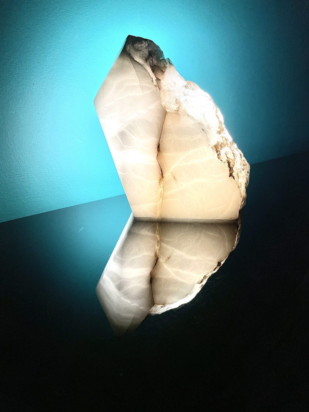 Illuminated white Alabaster. Lit from the back it shows the internal fractures of the stone, creating a window through the stone